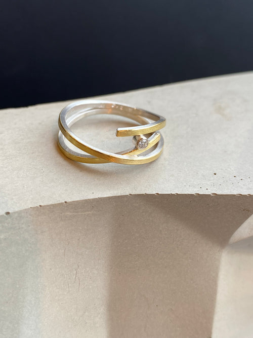 Delicate Silver And Gold Crossover Ring With Diamond