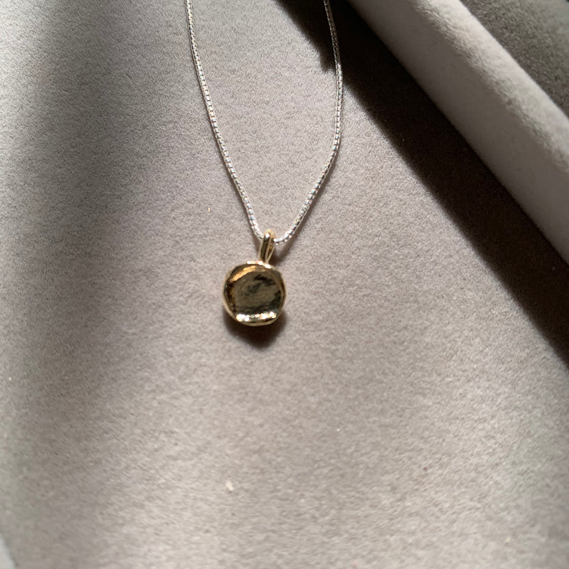 Silver chain and textured Gold Disc Pendant