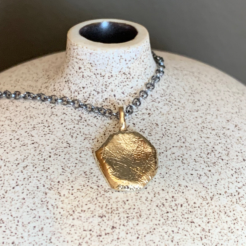 Two colour textured pendant necklace